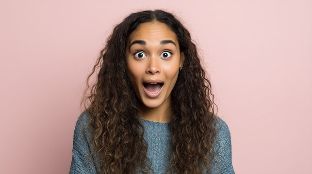 young black african american woman ( 24 years old) with a surprised and excited expression, neutral pastel background