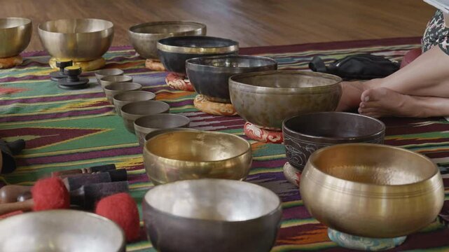 Tebet singing bowls stand on the floor before the start of the bowls ceremony in a gazebo on Bali Island