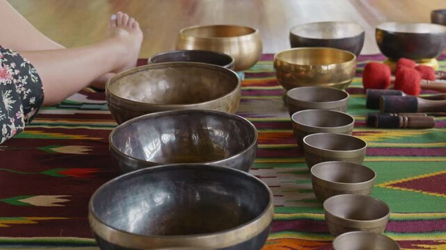 Tebet singing bowls stand on the floor before the start of the bowls ceremony in a gazebo on Bali Island