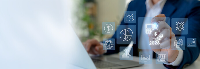 2026 budget and financial management concept. Business professional interacts the futuristic financial icons on virtual screen with budget planning, financial forecasting, efficient budget allocation.