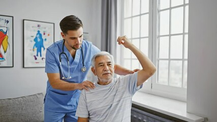 A young male physiotherapist supports an elderly patient with arm mobility exercises in a bright rehab room, capturing physical rehabilitation, patience and care for aging bodies in modern clinics - Powered by Adobe