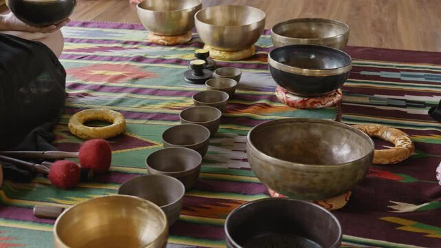 Tebet singing bowls stand on the floor before the start of the bowls ceremony in a gazebo on Bali Island