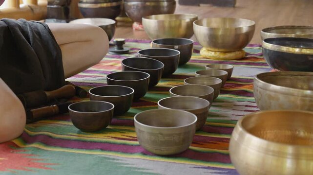 Tebet singing bowls stand on the floor before the start of the bowls ceremony in a gazebo on Bali Island