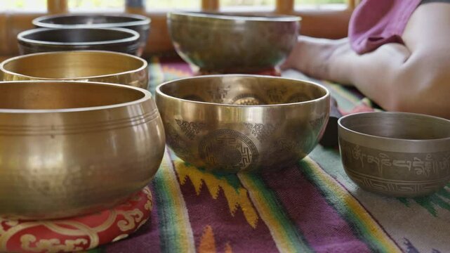 Tebet singing bowls stand on the floor before the start of the bowls ceremony in a gazebo on Bali Island