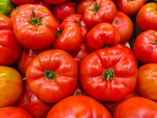 Red tomatoes on the market stall
