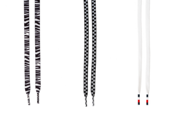 Stylish zebra, checkerboard, and classic white shoelaces on black background.