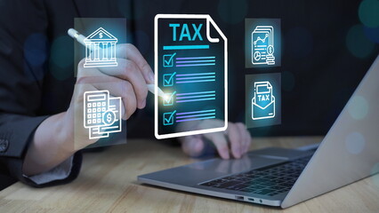 tax documents, and savings, represent the concept Tax Filing and Financial Management Concept. Businessperson using laptop with digital tax and finance icons.