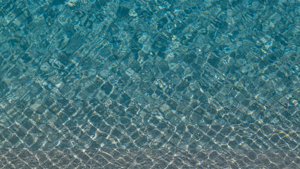 Clear Blue Water With Rippled Textures and Patterns in Sunlight
