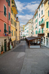 Brightly colored houses and boats in the picturesque Riomaggiore harbor, Cinque Terre, Italy...