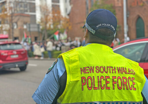 New South Wales police officer watching a protest