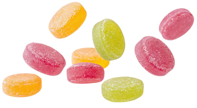 A scattered assortment of colorful hard candies in various shades against a black background space filling