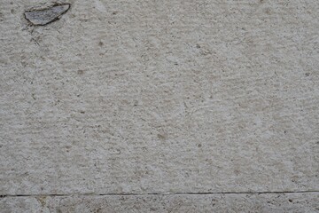 Old stone, concrete wall texture close-up. Wall background with rough stone surface