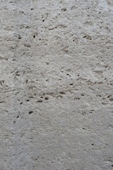 Old stone, concrete wall texture close-up. Wall background with rough stone surface