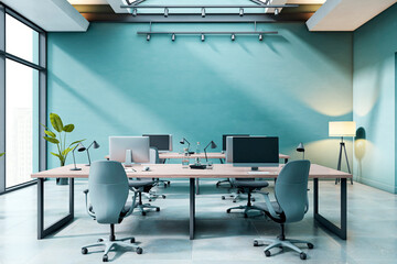 Modern empty office interior with desks, computers and chairs under skylight in contemporary business workspace with teal wall and clean design. 3D Rendering