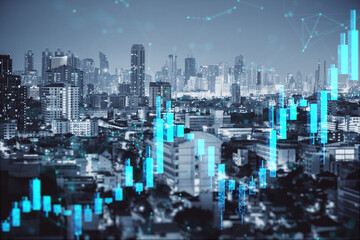 Financial stock chart overlay on city skyline showing urban economic growth and futuristic digital trading data concept at night.