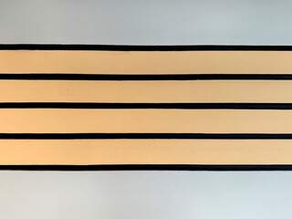 Horizontal stripes pattern in gold, grey, and black paint combination. Linear colorful stripes pattern seamless background texture. Elegant vibes