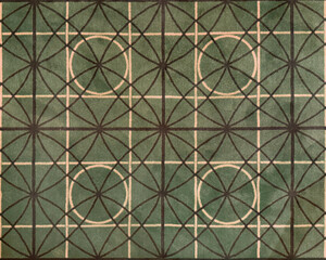 Close up of geometrical floral and circle pattern carpet rug. Green, white, and brown color. Geometrical modern floral star shapes seamless background texture.