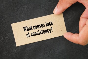 Box paper with the question word What causes lack of consistency? consistent concept