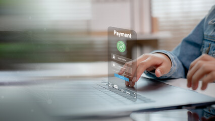 User entering password on secure payment login interface displayed on laptop screen. Concept of online transaction, data protection, digital banking, and cyber security.