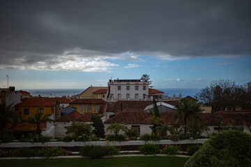 Old building over the ocean and the sunset