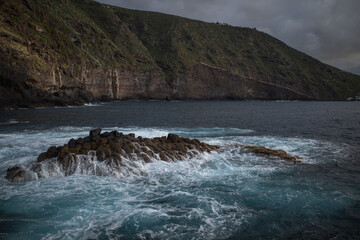 waves crashing on rocks