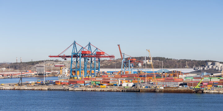 Gothenburg / Sweden, Mar 21, 2025: Panoramic view of the bustling Port of Gothenburg container terminal.