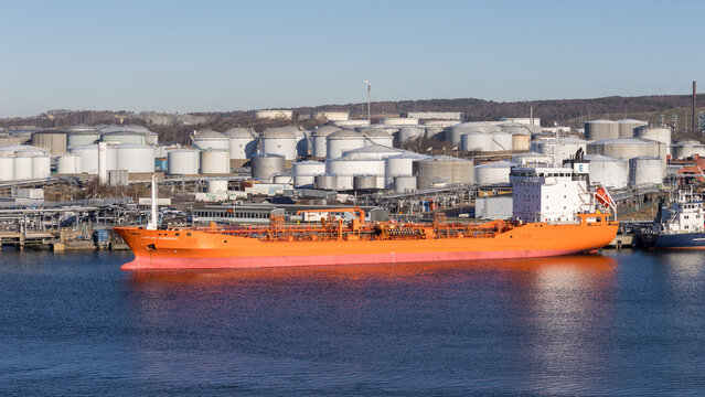 Gothenburg / Sweden, Mar 21, 2025: Orange chemical tanker Bow Excellence docked at a terminal.