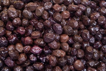 Close-up of dark wilted olives at a Turkish market in Istanbul. Natural background for design.
