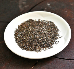 chia seeds close up image in a white plate