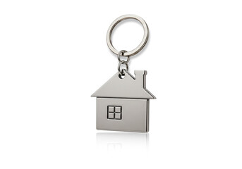 A silver house shaped keychain with a ring attached against a white background with a slight reflection