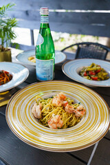 Italian pasta dishes served with sparkling water