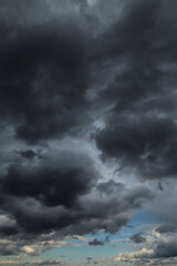 Epic Dramatic Storm sky with dark cumulus rainy clouds against blue sky abstract background texture, thunderstorm