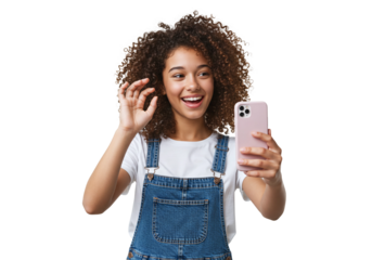 Teen girl taking selfie with smartphone, joyful expression, casual fashion on white studio background