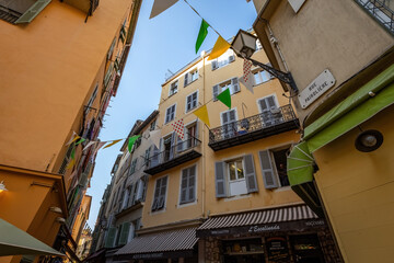 Old town house in Nice french architecture old house flags France