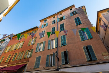 Old town house in Nice french architecture old house flags France