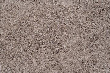 Old stone, concrete wall texture close-up. Wall background with rough stone surface