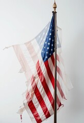 A Torn American Flag on a Flagpole: A Symbol of Time, Patriotism, and Remembrance