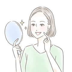 手鏡を見て綺麗な歯に感動する女性