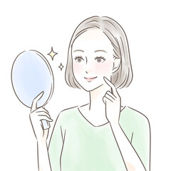 手鏡を見て綺麗な肌に感動する女性