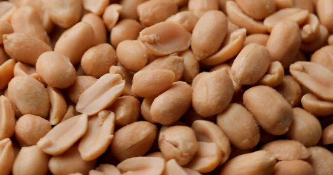 project video of golden crunchy salted peanuts showing off their crust and crisp being captured in detail