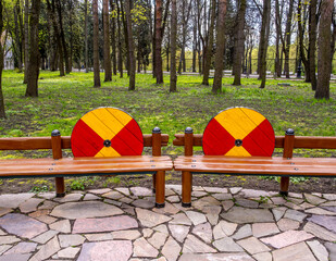 Benches in the park on a summer day.