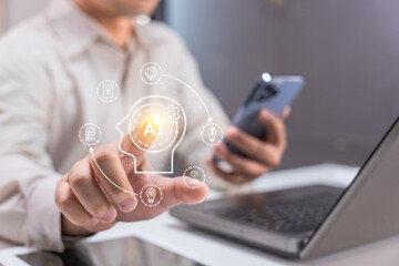 A person interacts with a virtual AI interface while using a smartphone and working on a laptop.