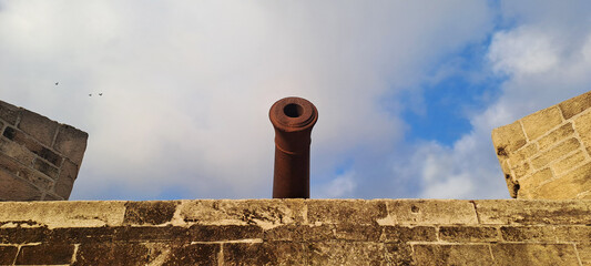 Historic cannon on ancient stone fortress wall of the casablanca skala