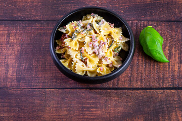 Carbonara pasta. Farfalle with pancetta, egg, parmesan cheese and cream sauce.
