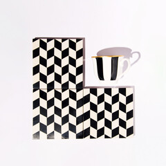 Retro nostalgic arrangement with a cup of espresso, popular vintage pattern background.