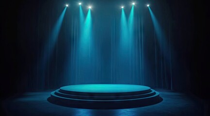 Empty stage lit by teal spotlights