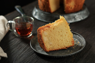 Sliced Cheese Chiffon Cake on Black Wooden Table