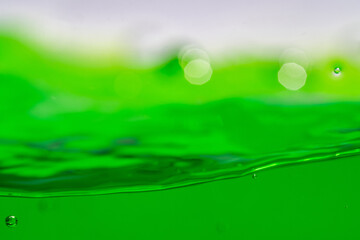 Water wave, close up of vibrant green liquid with bubbles, capturing dynamic movement and freshness. Perfect for backgrounds, beverages, or abstract concepts. soft drink