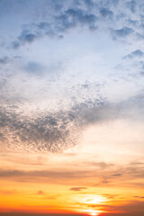 Sky,Beautiful sunset view, luxury soft gradient orange gold clouds and sunlight on the blue dramatic sky perfect for the background, morning, evening,Twilight, climate change,Vertical sunset photo