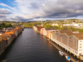 Colorful historical fishing houses of Trondheim, Norway, aerial view, Nidaros cathedral in the background